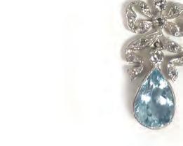 pendant of bow shaped form above a teardrop shaped aquamarine. overall 4.