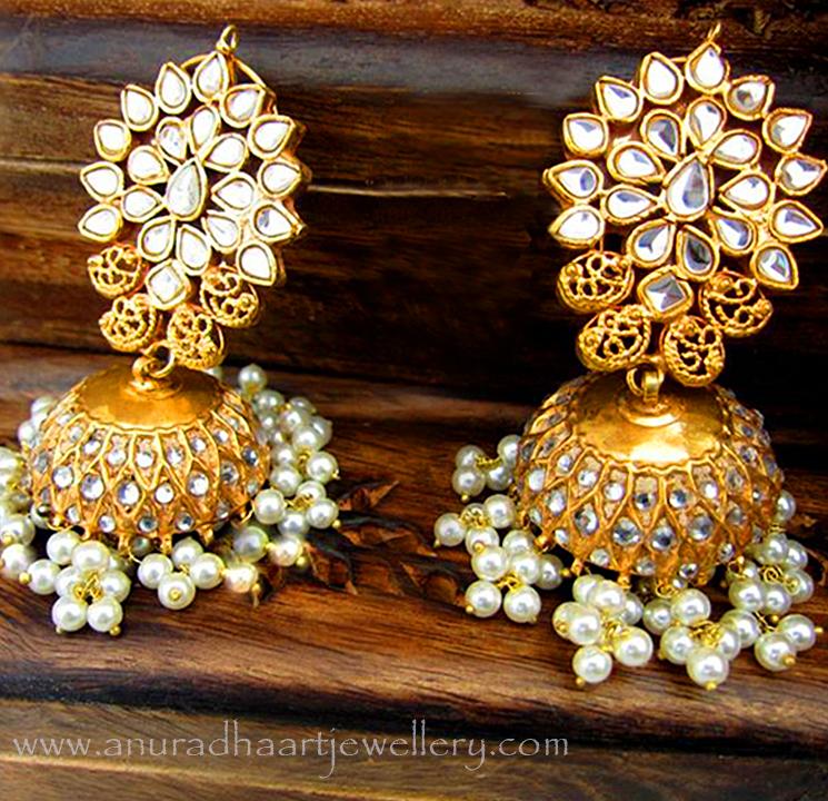 Ear-Cuffs Jhumkis Ear-cuffs styled along with jhumkis are known as ear-cuffs jhumkis.