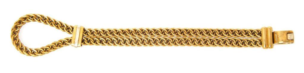Pomellato Lot 394 An 18 Karat Yellow Gold Bracelet, Pomellato, consisting of a double row interwoven chain link design with fluted slide adjuster section and fluted terminal with hinged oval clasp.