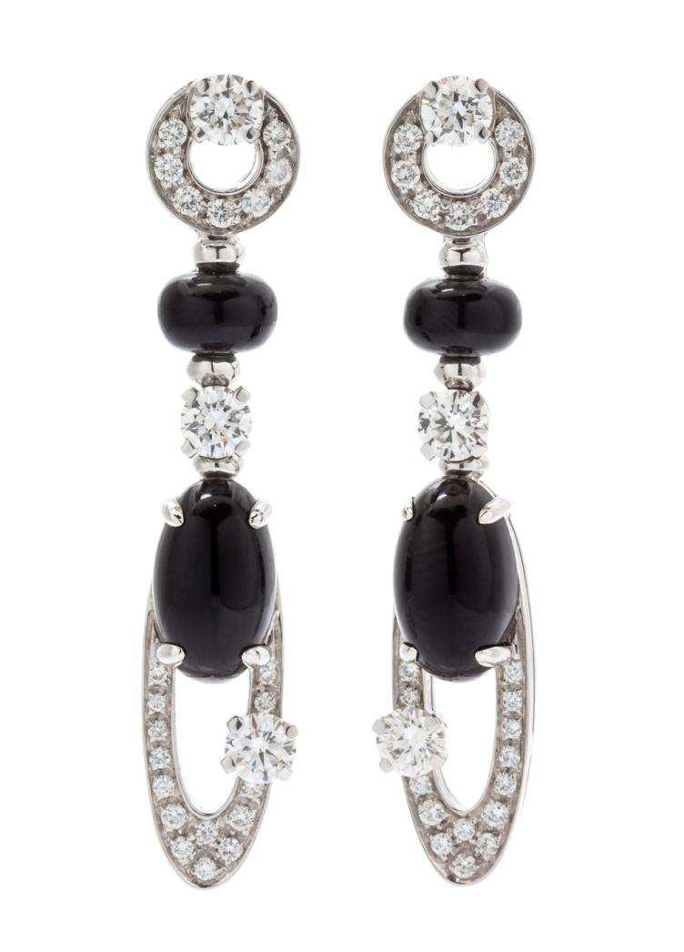 Lot 300 A Pair of 18 Karat White Gold, Onyx and Diamond Elisia Earclips, Bulgari, in an openwork drop design, containing 48 round brilliant cut diamonds weighing approximately 1.