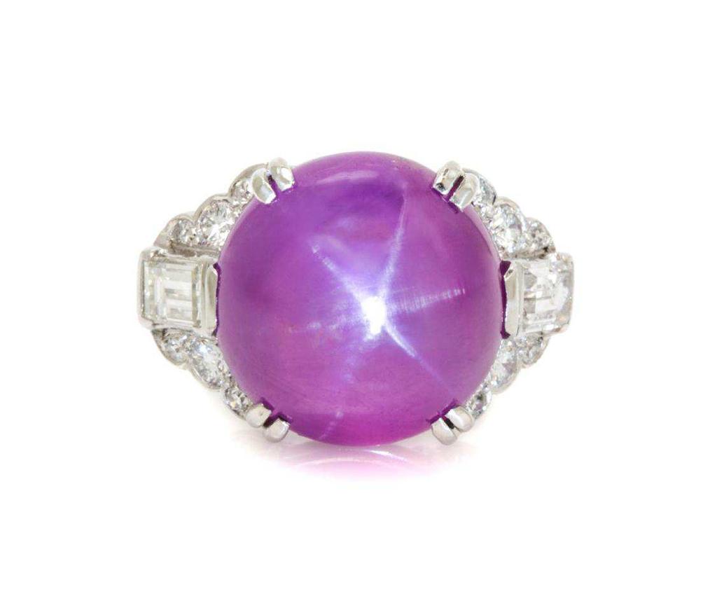 Birks Ellis-Ryrie Lot 84 A Platinum, Star Ruby and Diamond Ring, Birks Ellis-Ryrie, Circa 1940, containing one double cabochon cut star ruby weighing approximately 15.