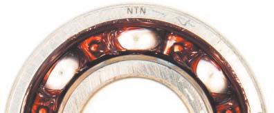 10 shows the result obtained with the diagonally recessed cage, with no attachment of grease to the inner ring seal groove observed.