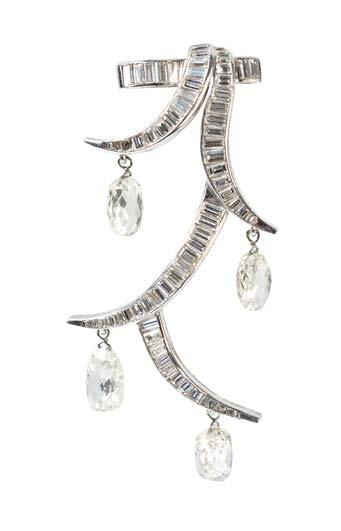 427 427 Platinum and Diamond Clip Brooch, Suzanne Belperron, France, c. 1940, set with baguette-cut diamonds and suspending four diamond briolettes, approx. total wt. 7.00 cts., lg. 2 1/4 in.