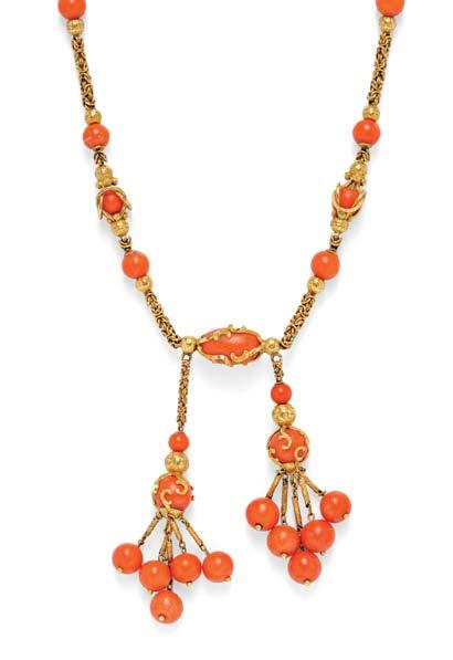 131 131 Antique Gold and Coral Négligée, the coral bead tassels suspended from a necklace of round and barrel-shape coral beads, the barrels wrapped in gold rocaille motifs, and joined by rope chain,
