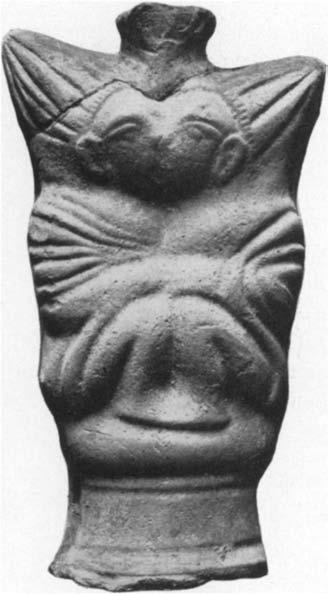 The right arm is bent across the chest and holds in the hand an object difficult to identify but presumably a syrinx.