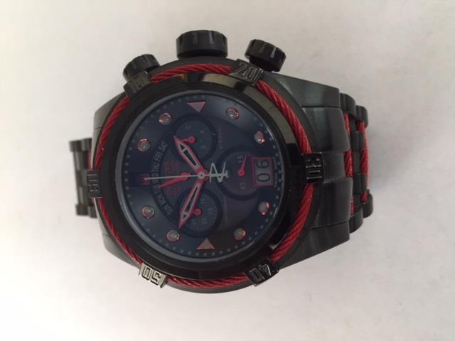 Item 29: Make: Invicta Model: Jason Taylor Reference: 16001 Serial: 112803-1261473 Case Metal: Black ion plated stainless steel Case Diameter: 53mm Bezel: Fixed black ion plated with red cable wire