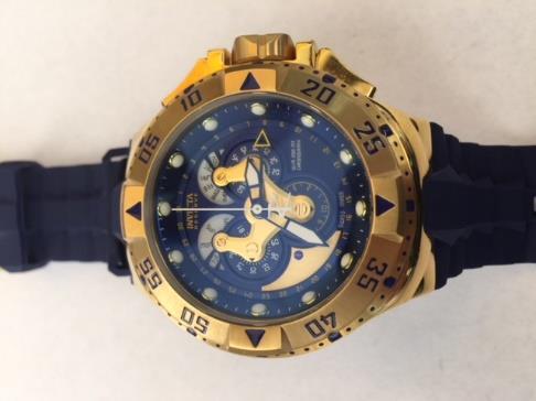 Item 33: Make: Invicta Model: Excursion Reference: 18558 Serial: 112803-1406911 Case Metal: Gold plated stainless steel Case Diameter: 50mm Dial: Blue Bezel: Uni-directional rotating gold plated