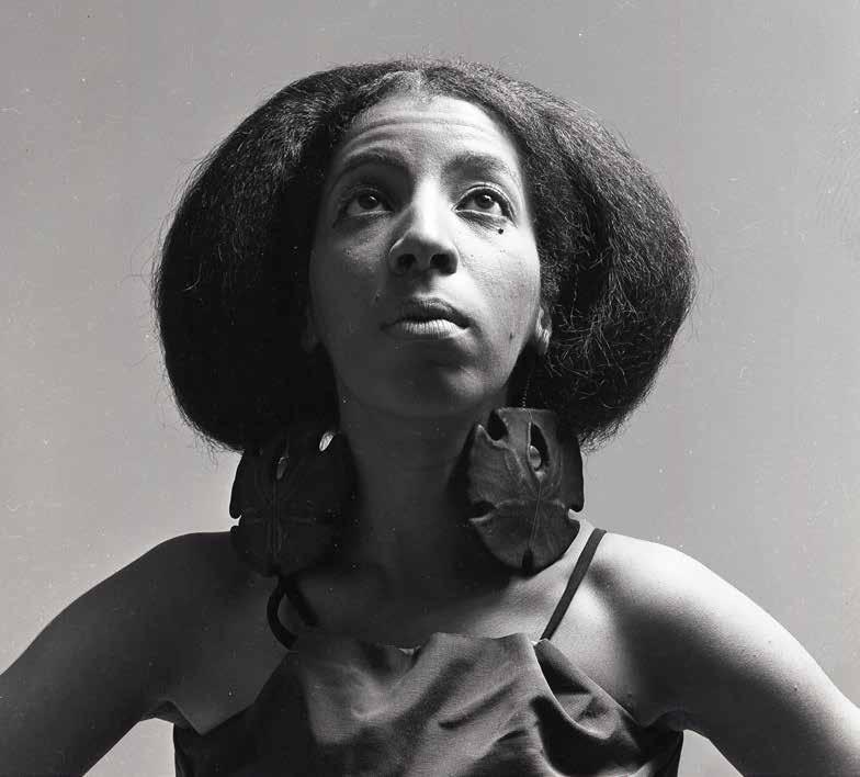 Fashion designer Carolee Prince wearing her own clothing and earrings, c. 1966. were established to represent women previously overlooked in fashion, art, and culture.