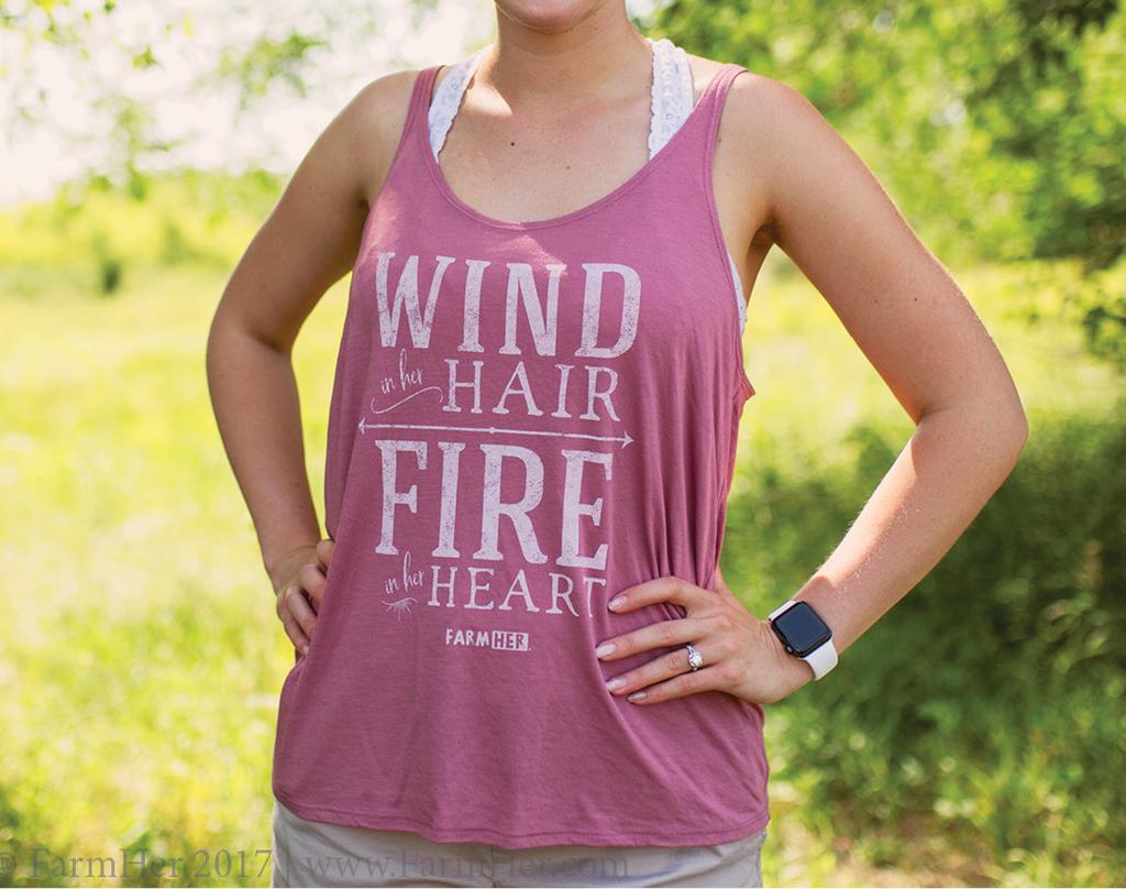 140T FarmHer Wind in Her Hair Tank Wholesale Price: $12 USD; $14USD for XXL Imprint reads: Wind in Her Hair, Fire in Her Hair Color: Mauve
