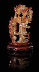 23. $800-1,200 669 A Carved Tianhuang Stone Seal of square form, the top carved to show a crouching dragon amongst clusters of clouds. Height 1 5/8 inches.