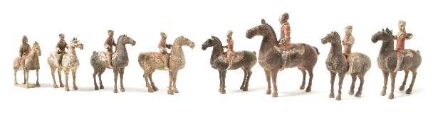 Peter M. Greiner Trust, Rockford, Illinois 32* Two Pottery Figures of Horses HAN DYNASTY each animal igure depicted standing. Height of taller 13 inches. Property from the Dr. Peter M.