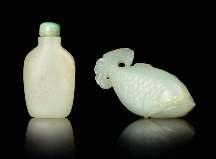 741 742 743 744 745 746 741 Two Jade Snuf Bottles the irst of lattened rectangular form bearing inscriptions, the second of ish form. Length of longer 3 inches.