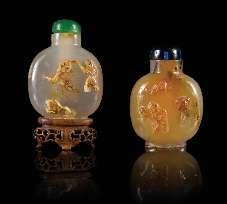749 750 751 752 749 Four Carved Agate Snuf Bottles comprising an example of lattened circular form and three examples of baluster form. Height of tallest 3 inches.