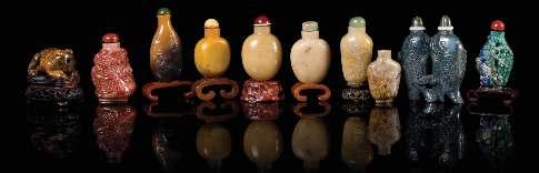 755 757 755 A Carved Agate Snuf Bottle LATE QING DYNASTY the stone of a grey tone, of rounded form carved and utilizing the light russet skins to show a igure on a boat above waves, raised on a itted