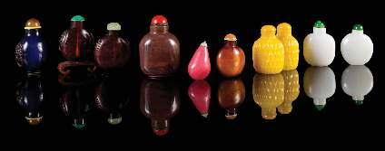 Property of a Private Midwest Collector $1,000-2,000 768 Ten Peking Glass Snuf Bottles 19TH-20TH CENTURY comprising a pair of yellow glass carved with basketweave motifs, two of ruby red glass, two