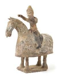 Greiner Trust, Rockford, Illinois $1,000-2,000 44* A Painted Pottery Equestrian Figure POSSIBLY NORTHERN WEI DYNASTY the igure depicted with both hands raised and slightly turned to the left.