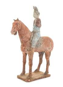 Greiner Trust, Rockford, Illinois $1,500-2,500 60* A Pottery Equestrian Figure the male igure depicted seated upright, covered in a clear lustrous glaze.