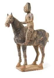 Greiner Trust, Rockford, Illinois $700-900 62* A Grey Pottery Equestrian Figure depicting an oicial riding a standing horse. Height 19 inches. Property from the Dr.