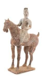 Greiner Trust, Rockford, Illinois $1,000-2,000 63 63 A Painted Pottery Equestrian Figure TANG DYNASTY the male igure depicted dressed in long robes with his body