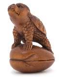 465 463 464 469 471 466 467 463 A Carved Wood Netsuke depicting a boy standing on a carp, incised with a two-character maker s mark to the underside. Height 2 inches.