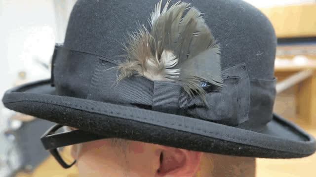 The feather accent serves to obscure the circuit from view-- feel free to glue it in place if you like! This hat is not weatherproof!if it rains, power down and stow your hat.