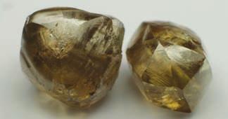 3-20: Stepped and slightly rounded diamond with deep brown body color (0.95 ct).