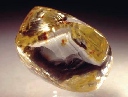 Chapter 3: The Colors of Diamonds 3-01: Transparent yellow diamond with dodecahedral habit (1.02 ct). The pale yellow color, or cape yellow, is typical for Type Ia diamonds.