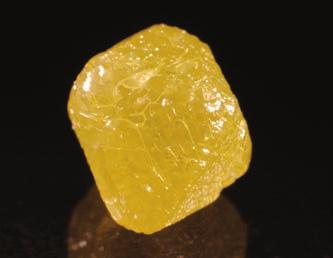 3-02: Slightly rounded, octahedral diamond with an intense yellow color (1.10 ct).