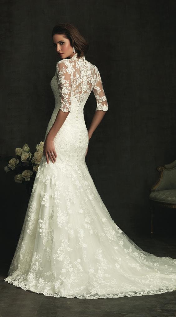 The bodice features a v-shaped neckline, 3/4 length sleeves with sheer lace
