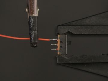 wire overlapping a terminal on the slide switch.