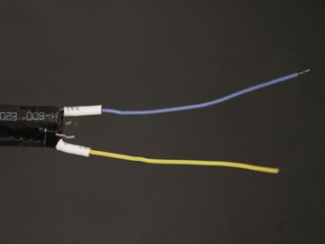 Apply heat shrink tubing to the exposed terminals to insulate the connections.