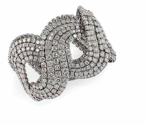 457 457 Platinum and Diamond Bracelet, the wide strap designed as a braid set with full-cut diamonds, approx. total wt. 65.00 cts., wd. 1 7/8, lg. 7 7/8 in.