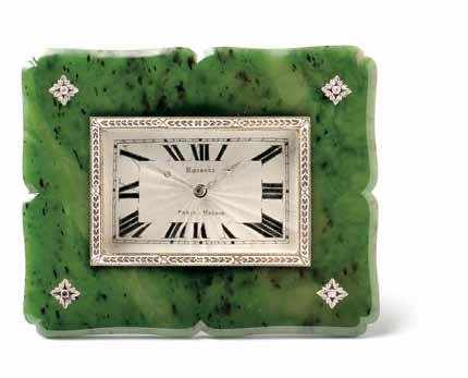 637 637 Art Deco Nephrite Pendulette, Retailed by Rozanes, Paris and Madrid, the guillocheengraved dial with Roman numeral indicators and diamond hands, gold and enamel bezel, within a shaped