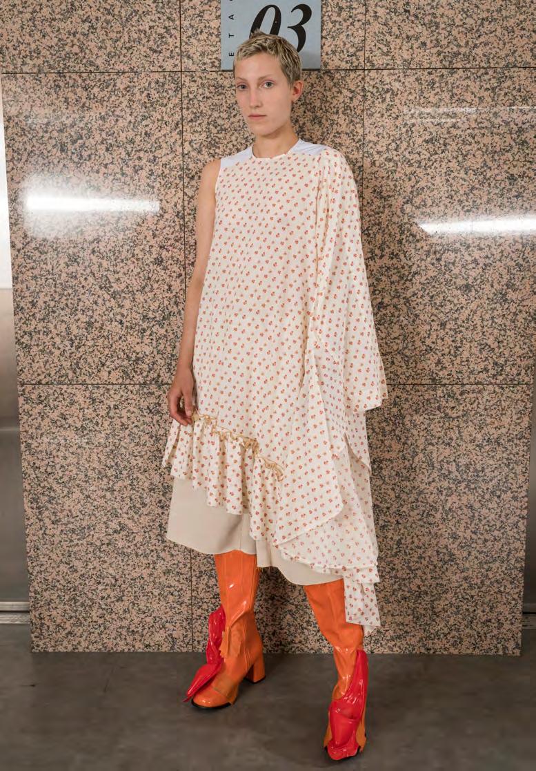 LOOK 14 SS1814D09 DITSY FLOWER ASYMMETRIC RUFFLE DRESS DITSY FLOWER CO VOILE RUFFLE DRESS. ASYMMETRIC SINGLE SLEEVE DECONSTRUCTED FROM A SECOND DRESS. YOKE IN CLASSIC SHIRTING STRIPE.