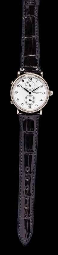 90 90 An 18 Karat White Gold Ref. 5034G Travel Time Wristwatch, Patek Philippe, 34.