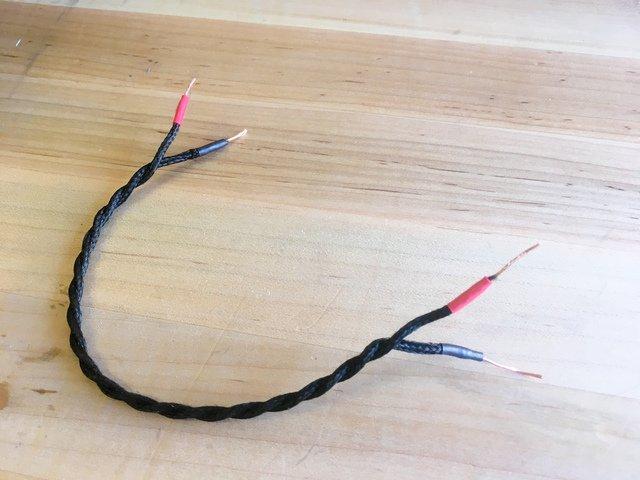 Slip a bit of heat shrink tubing over the end of each wire and then push the LEDs through a 1x2 jumper houseing (this is optional, it just keeps the legs from shorting and looks neat) solder a wire