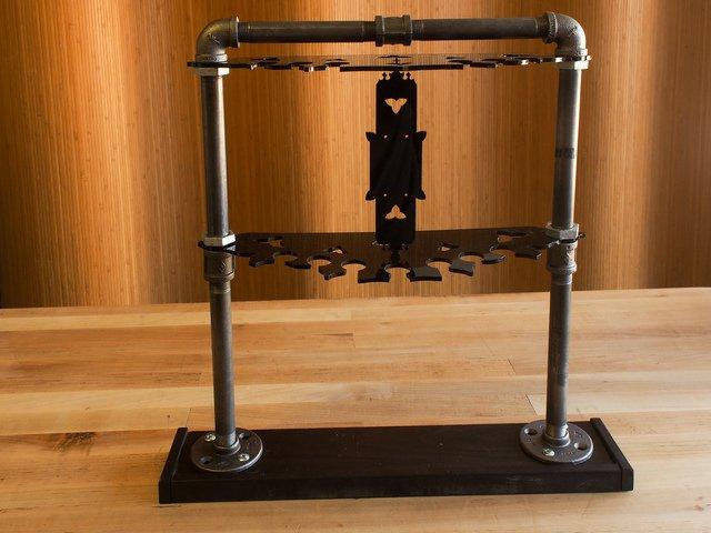 Assemble the Rack Black iron gas pipe and fittings are relatively inexpensive, strong, and modular, which can make them ideal for fabricating sturdy props and mounts.