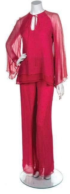 auction HIGH LIGH TS 110 111 115 110* A Stephen Burrows Magenta Pant Ensemble, comprised of a studded blouse with wide sleeves, front tie detail, and a layered hem, and a pair of matching studded
