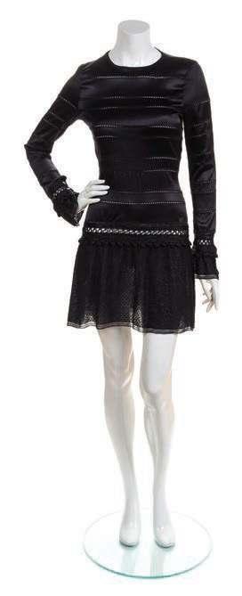19 20 27 19* A Chanel Black Mini Dress, Autumn 2003, with crochet detail at waist and cufs, textured skirt, and buttoned cufs. Labeled: Chanel. Size 40.