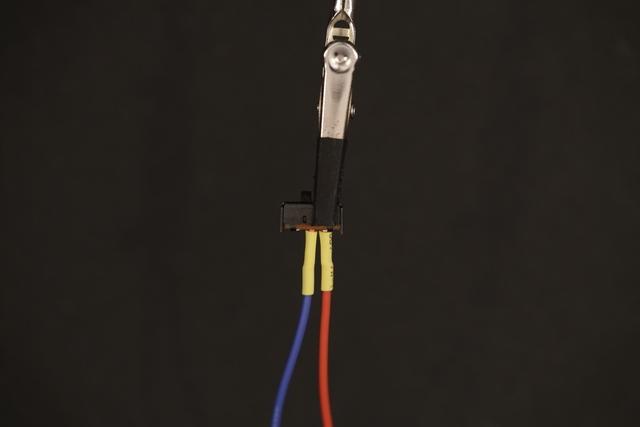 Heat Shrink Slip on pieces of heat shrink tubing to the exposed connections and appy some heat to them to shrink them - a