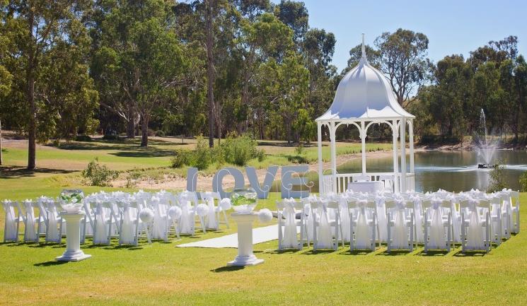 hooks and silk rose kissing balls choice of coloured carpet or seagrass aisle runner 2 white pedestals with giant fishbowls with clear or black acrylic ice with