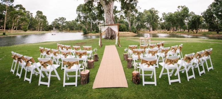 Ceremony 32 Americana chairs with hessian sashes seagrass aisle runner 6 wooden stumps 1 large jar with fresh