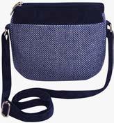 A compact shoulder bag with adjustable cord strap and two zipped, and