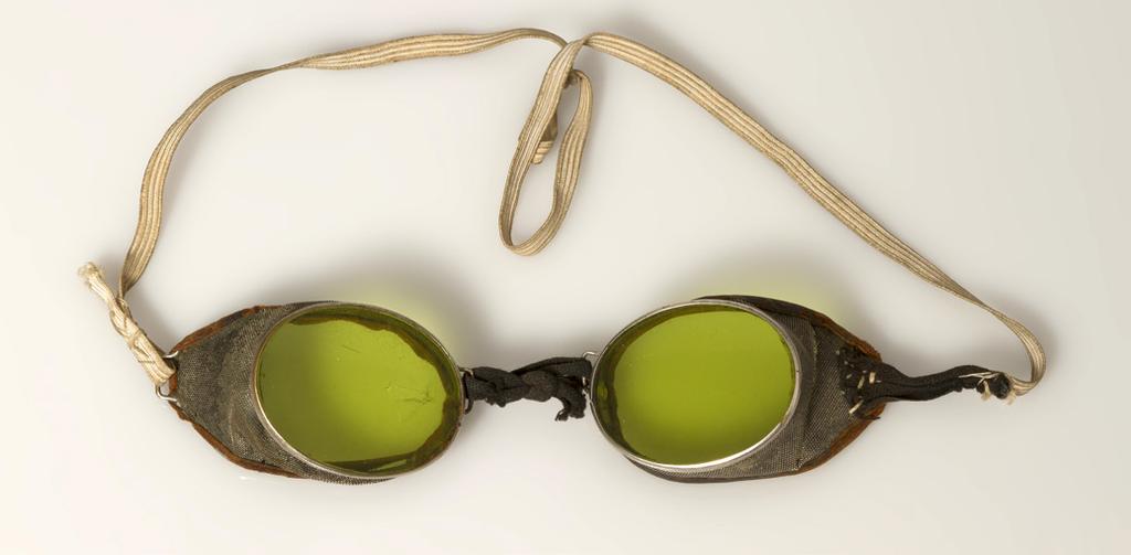 The metal goggles with green glass lenses were worn by Sir Ernest Shackleton on the Imperial Trans-Antarctic Expedition 1914 16 (also called the Endurance expedition, after the ship).