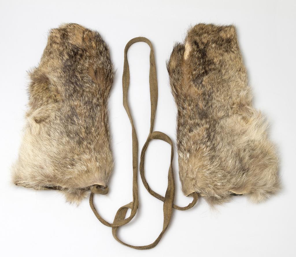 WHAT? WHERE? WHEN? WHO? MITTENS These mittens are made from wolf skin and have separate inner mittens made from leather. The mittens are joined together by a glove harness made of lampwick.