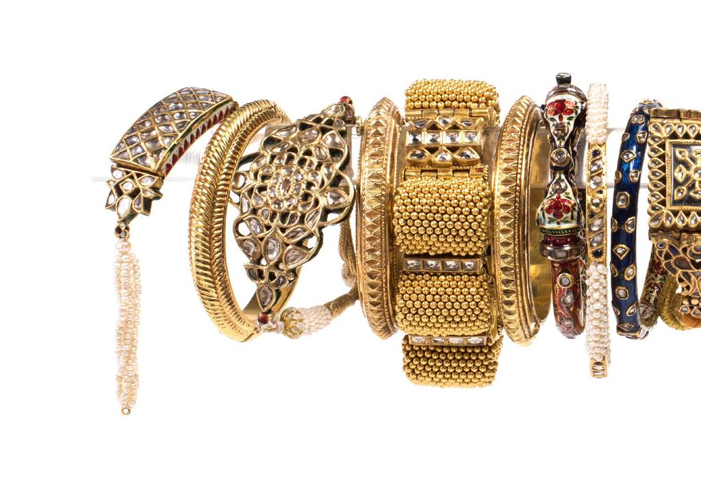 Bangles...They wear on their arms, above the elbow, rich armlets two inches wide, enriched on the surface with stones, and having small bunches of pearls depending from them.