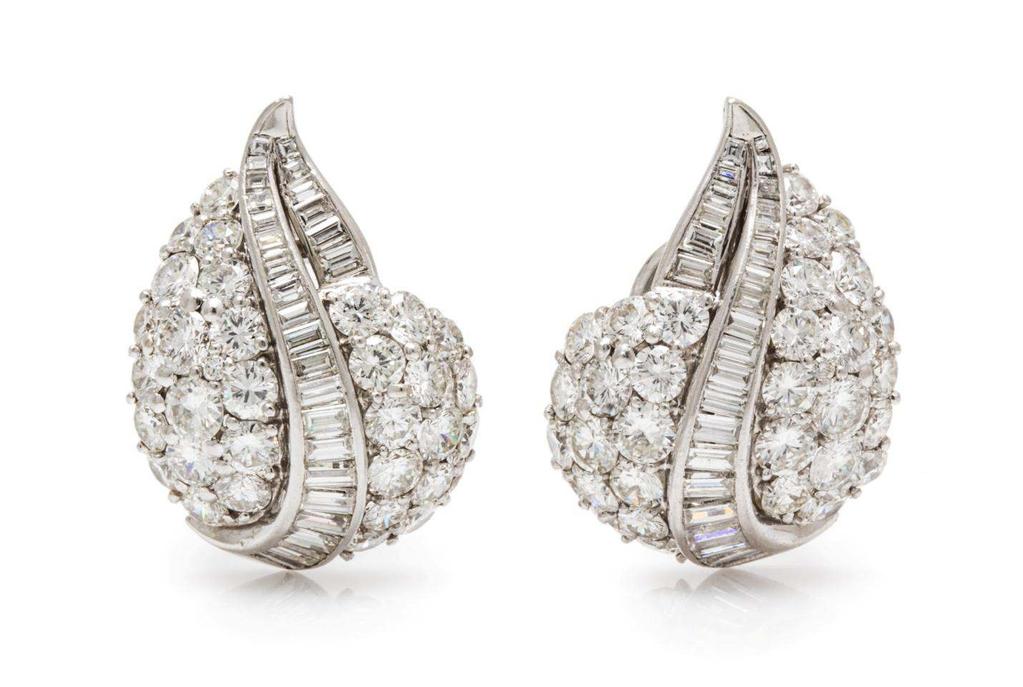 Ruser Lot 477 A Pair of Platinum and Diamond Earclips, Ruser, in a drop design, containing 64 round brilliant and transitional cut diamonds weighing approximately 8.