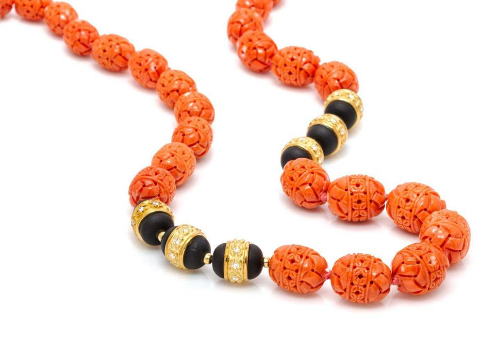 Lot 444 An 18 Karat Yellow Gold, Coral, Onyx, and Diamond Bead Necklace, Henry Dunay, in a graduated design containing 35 barrel shape carved orange coral beads measuring from approximately 14.