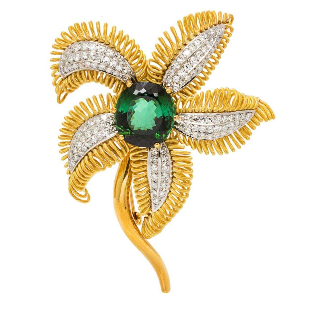 Lot 366 An 18 Karat Yellow Gold, Green Tourmaline and Diamond Flower Brooch, H. Stern, the stamen containing one oval mixed cut green tourmaline measuring approximately 16.10 x 15.00 x 10.