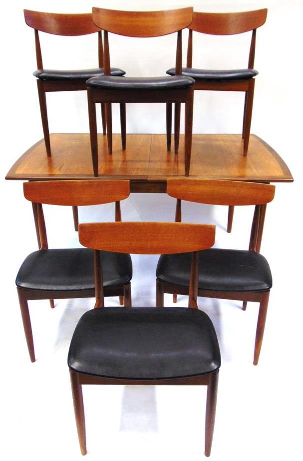 Lot 339 Lot 335 335 A G-PLAN TEAK DINING ROOM SUITE comprising extending dining table 147cm long 89cm deep 73cm high; set of six dining chairs with oval teak backrests and black vinyl seats; and a